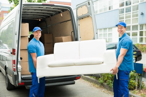 Loading boxes and household items into a van in St Johns