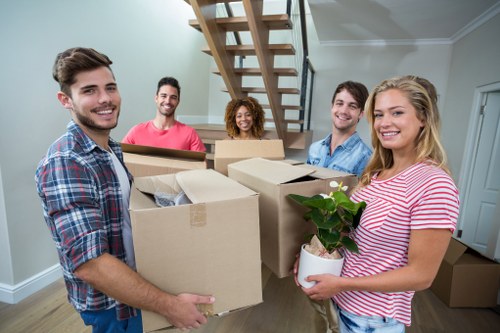 Removal van and moving team preparing a house move in St Johns