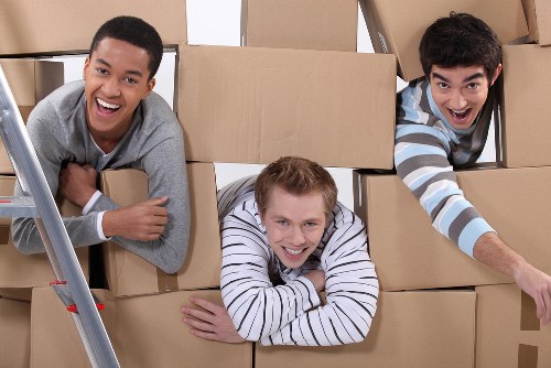 Office removals team loading business items for a local move in St Johns