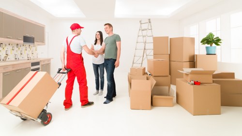 Local movers unloading household items at a St Johns property