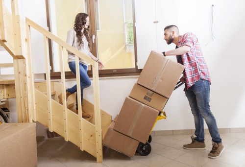 Careful loading of household items into a van in Stjohns