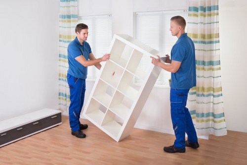 Safety-focused moving crew reviewing access and handling procedures