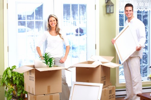 Careful handling of boxed office items during a commercial relocation