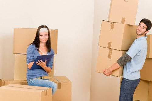 A local removals team assisting with a home move and boxed belongings