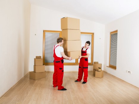 Local removal van loading furniture for a St Johns property move